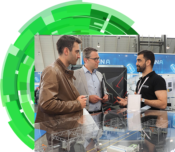 Exhibitor speaking to customers at Electric & Hybrid Vehicle Technology Expo Europe