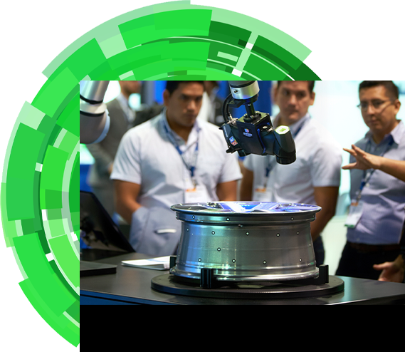 An exhibitor introducing a robot to three show attendees